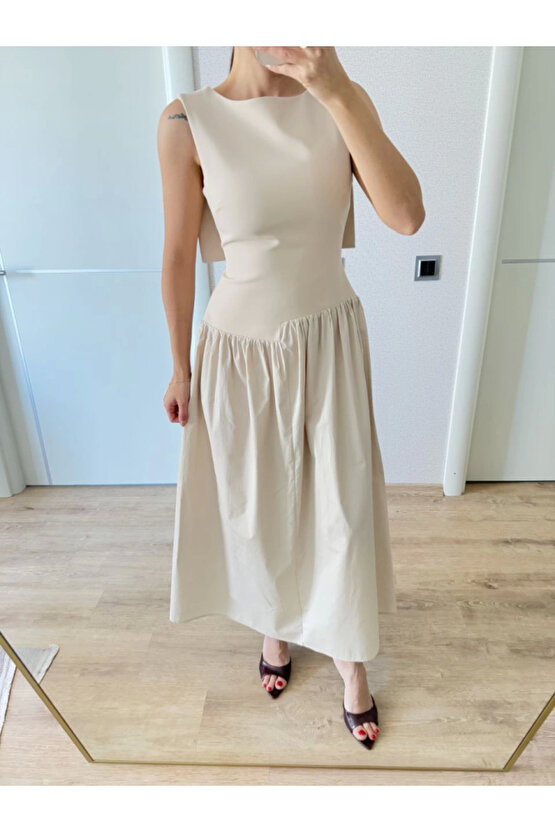 Gökyüzü Moda Arkası Kanatlı Uzun Elbise- Bej