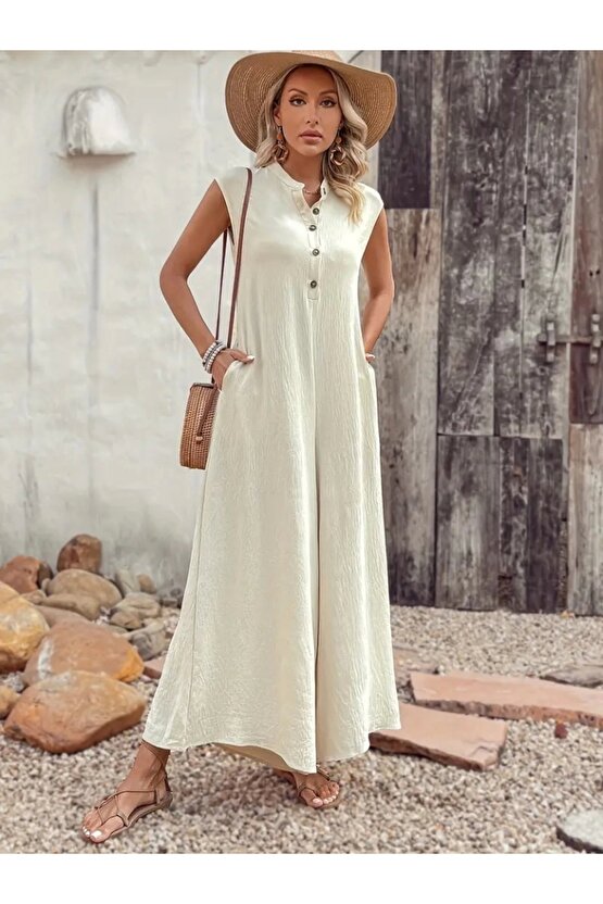 Kadın Kısa Kollu önden Düğmeli Paçaya Doğru Geniş Cepli Uzun Bürümcük Tulum